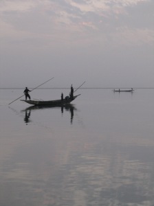 Fishermen on Lac Debo at twilight